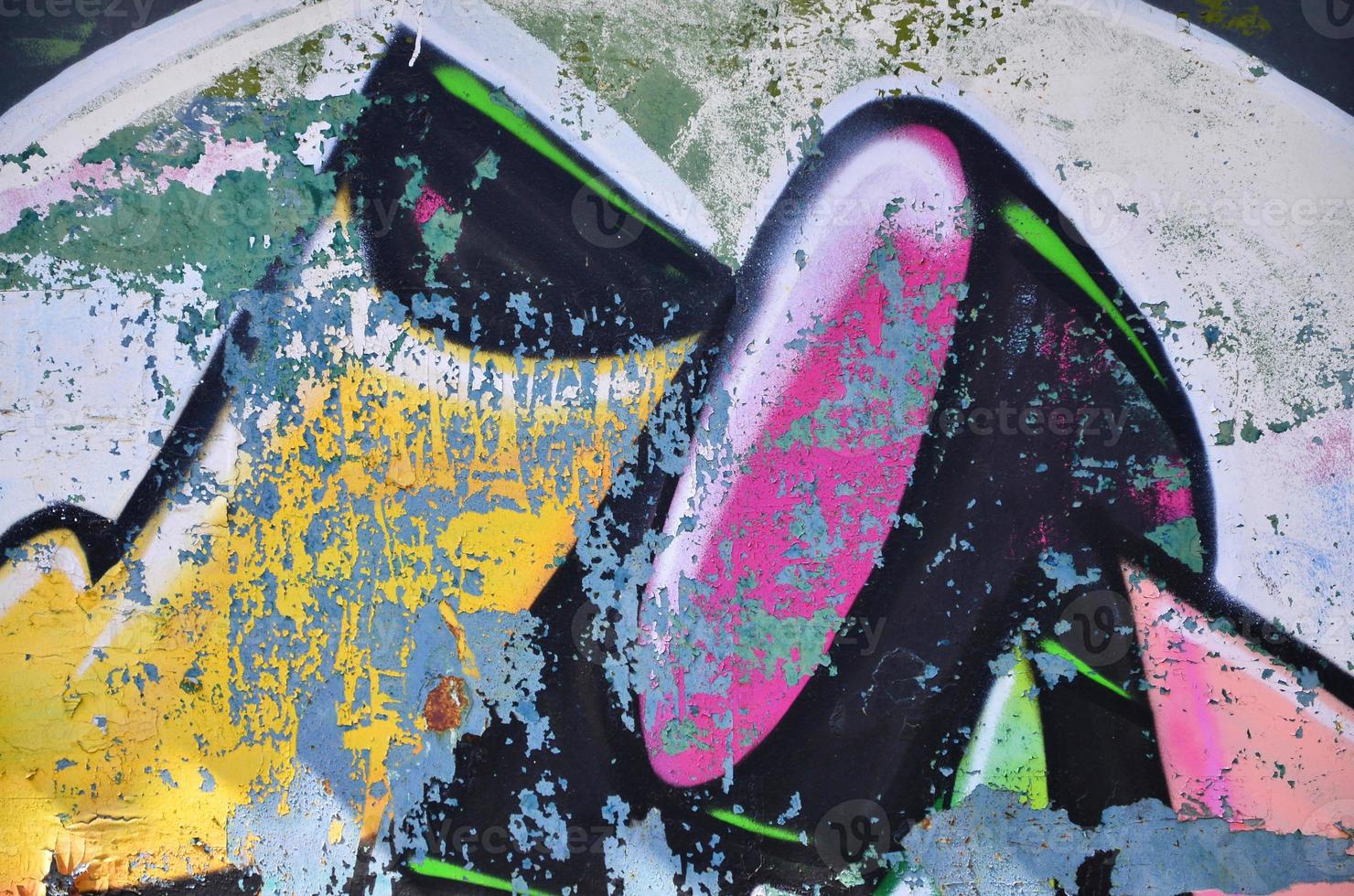 The old wall, painted in color graffiti drawing with aerosol paints. Background image on the theme of drawing graffiti and street art photo
