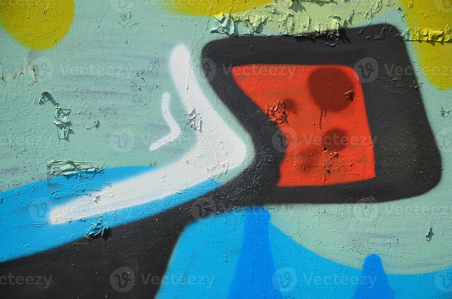 The old wall, painted in color graffiti drawing green aerosol paints. Background image on the theme of drawing graffiti and street art photo