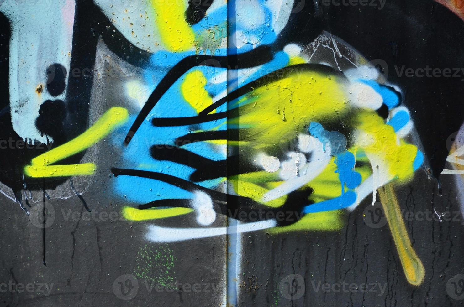 The old wall, painted in color graffiti drawing with aerosol paints. Background image on the theme of drawing graffiti and street art photo