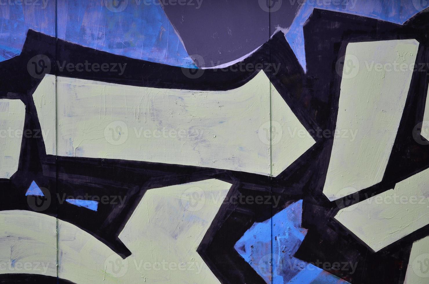 The old wall, painted in color graffiti drawing with aerosol paints. Background image on the theme of drawing graffiti and street art photo