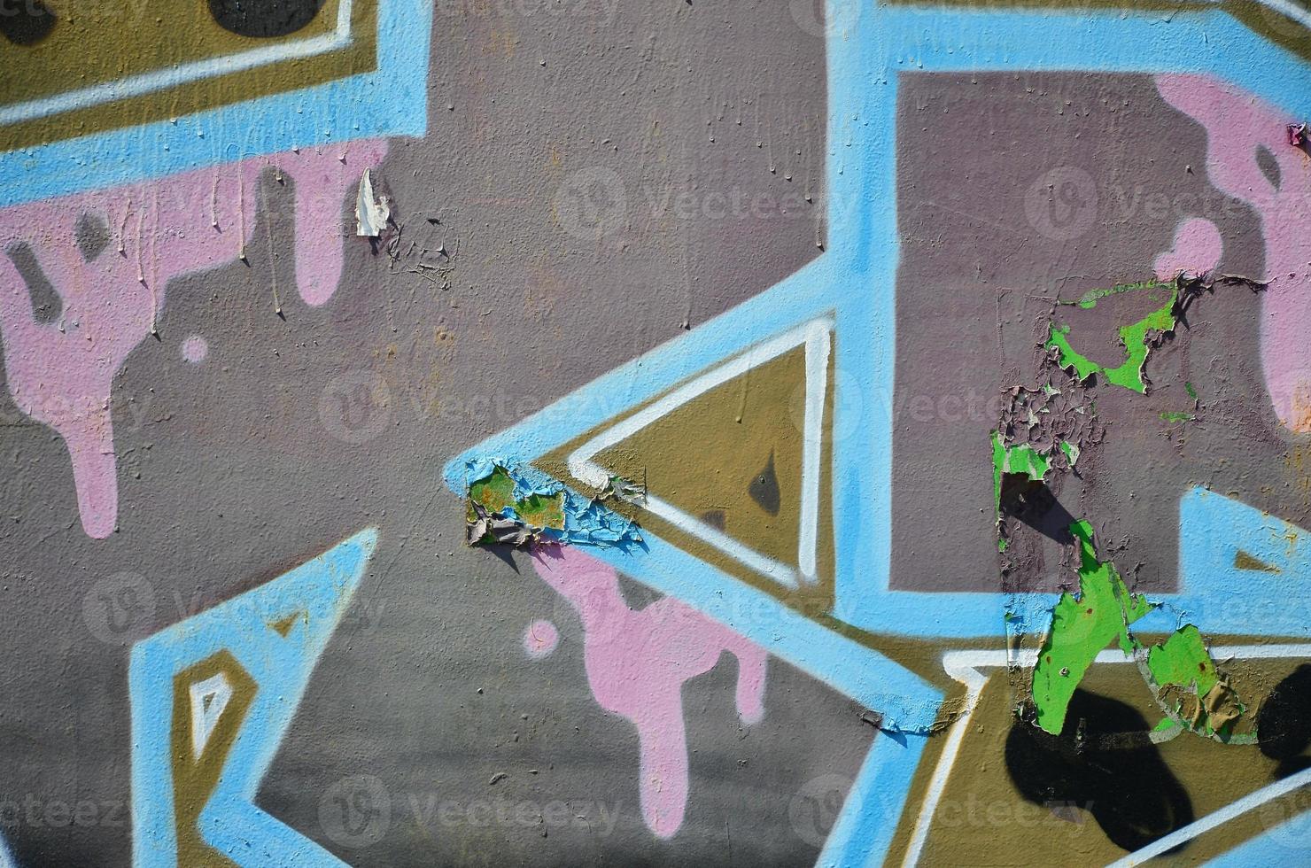 The old wall, painted in color graffiti drawing with aerosol paints. Background image on the theme of drawing graffiti and street art photo