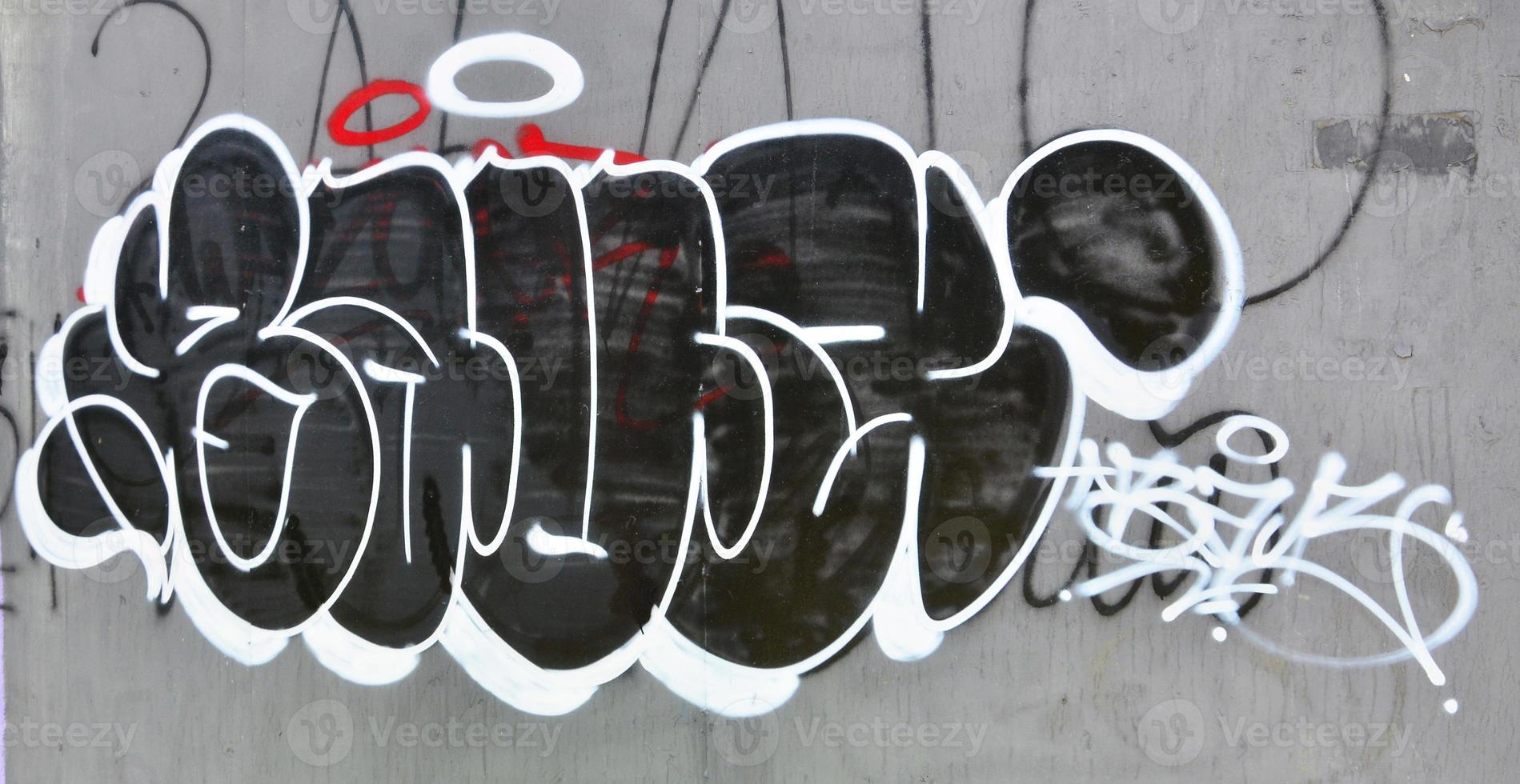 The old wall, painted in color graffiti drawing with aerosol paints. Background image on the theme of drawing graffiti and street art photo