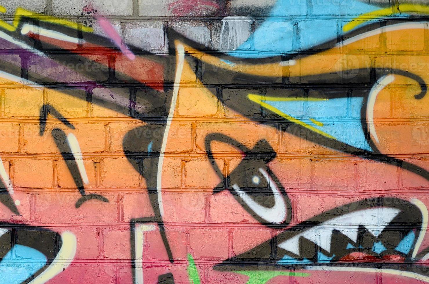 Abstract colorful fragment of graffiti paintings on old brick wall. Street art composition with parts of unwritten letters and multicolored stains. Subcultural background texture photo