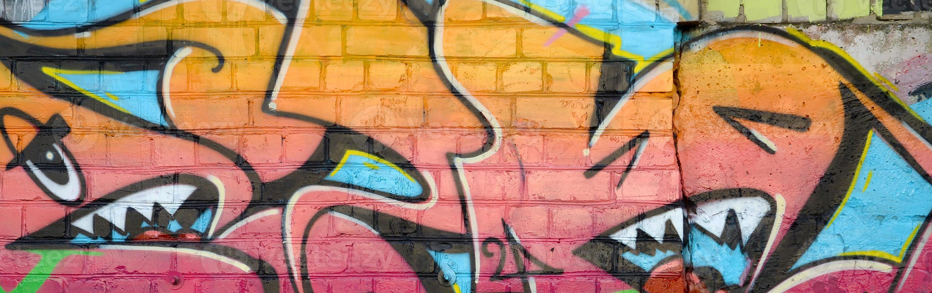 Abstract colorful fragment of graffiti paintings on old brick wall. Street art composition with parts of unwritten letters and multicolored stains. Subcultural background texture photo