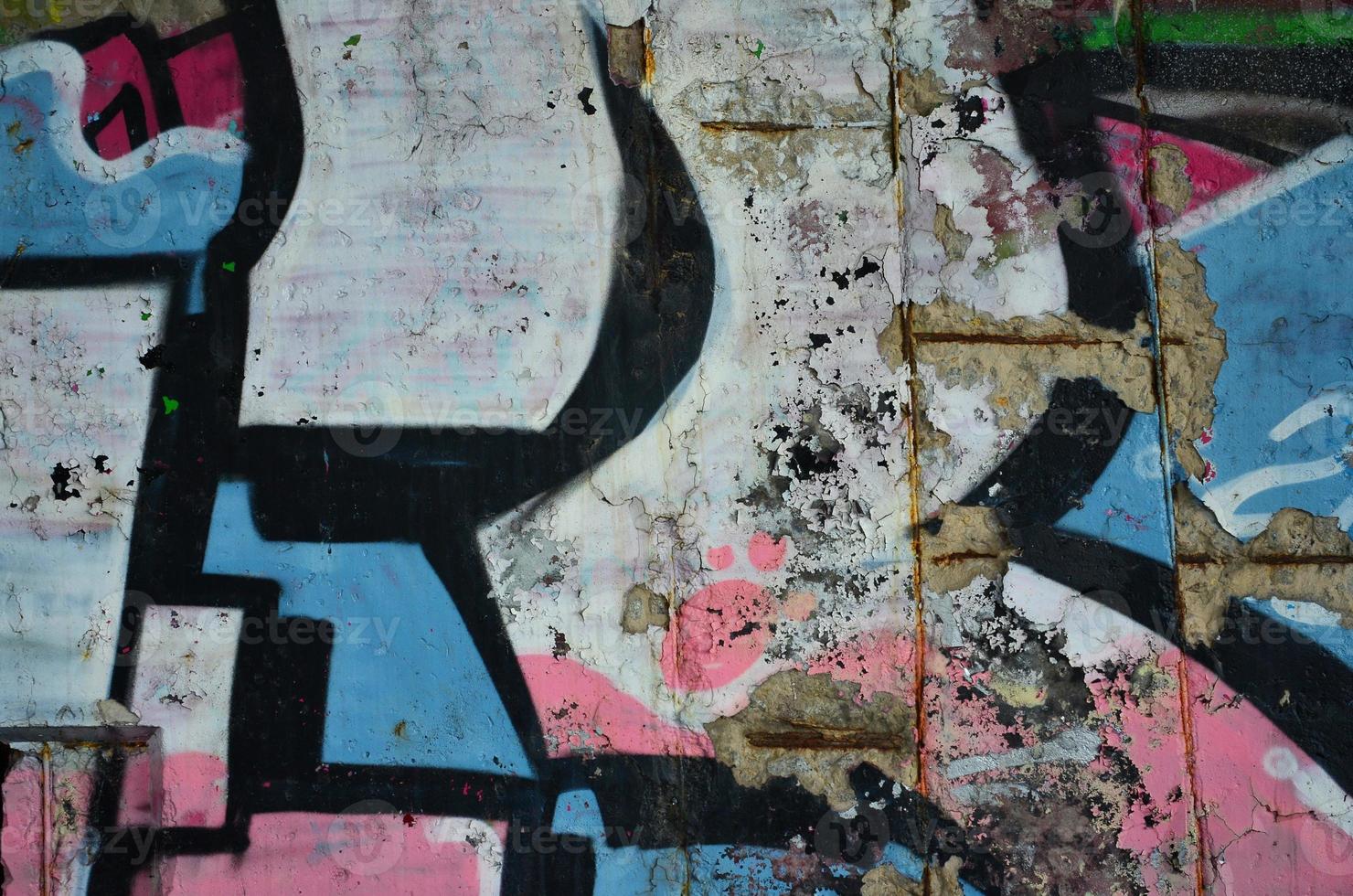 Texture of a fragment of the wall with graffiti painting, which is depicted on it. An image of a piece of graffiti drawing as a photo on street art and graffiti culture topics