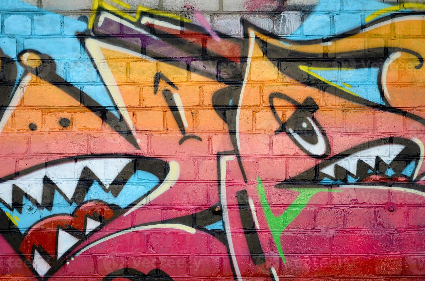 Abstract colorful fragment of graffiti paintings on old brick wall. Street art composition with parts of unwritten letters and multicolored stains. Subcultural background texture photo