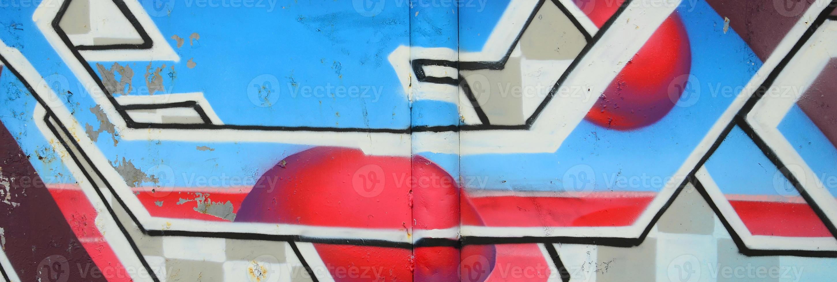 fragmento de dibujos de graffiti. la antigua muralla decorada con manchas de pintura al estilo de la cultura del arte callejero. textura de fondo coloreada en tonos fríos foto