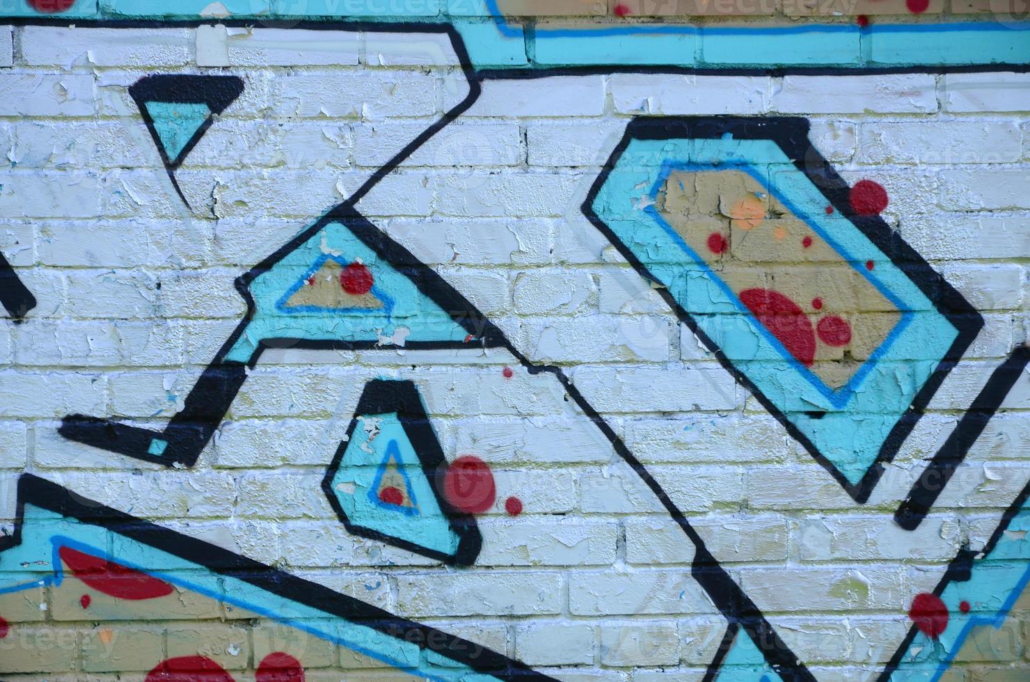 Fragment of graffiti drawings. The old wall decorated with paint stains in the style of street art culture. Colored background texture in cold tones photo