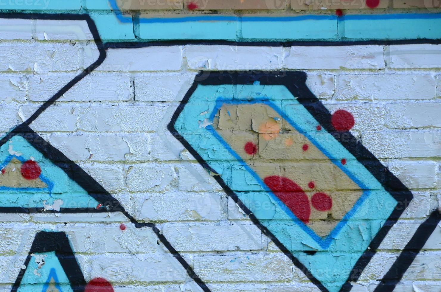 Fragment of graffiti drawings. The old wall decorated with paint stains in the style of street art culture. Colored background texture in cold tones photo