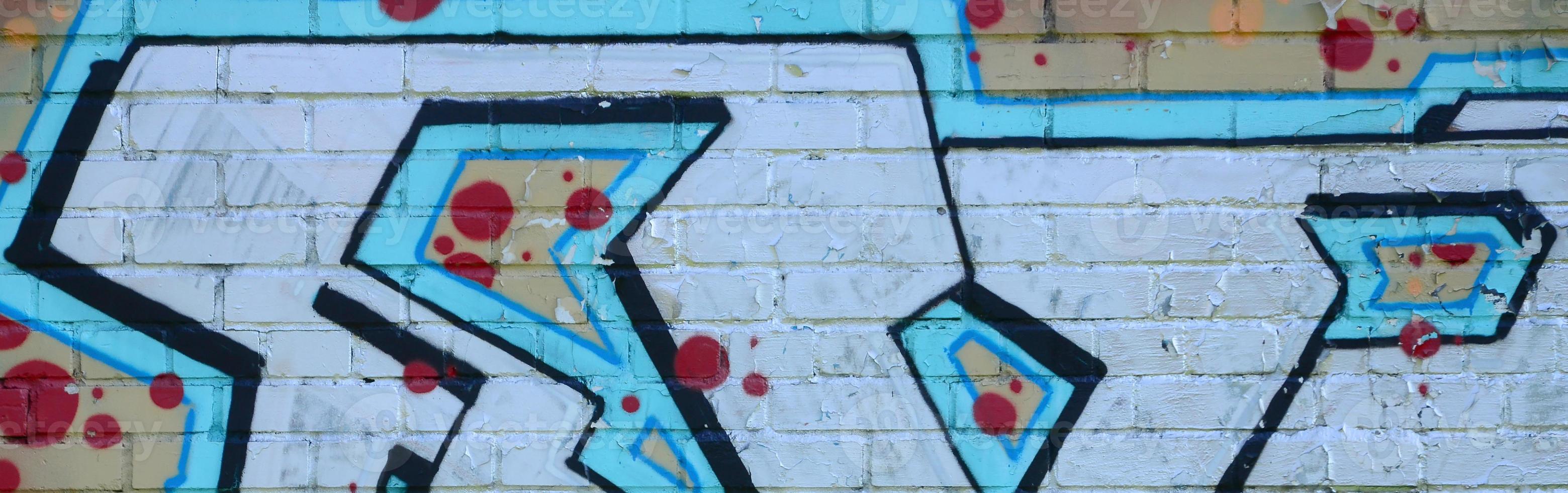 Fragment of graffiti drawings. The old wall decorated with paint stains in the style of street art culture. Colored background texture in cold tones photo
