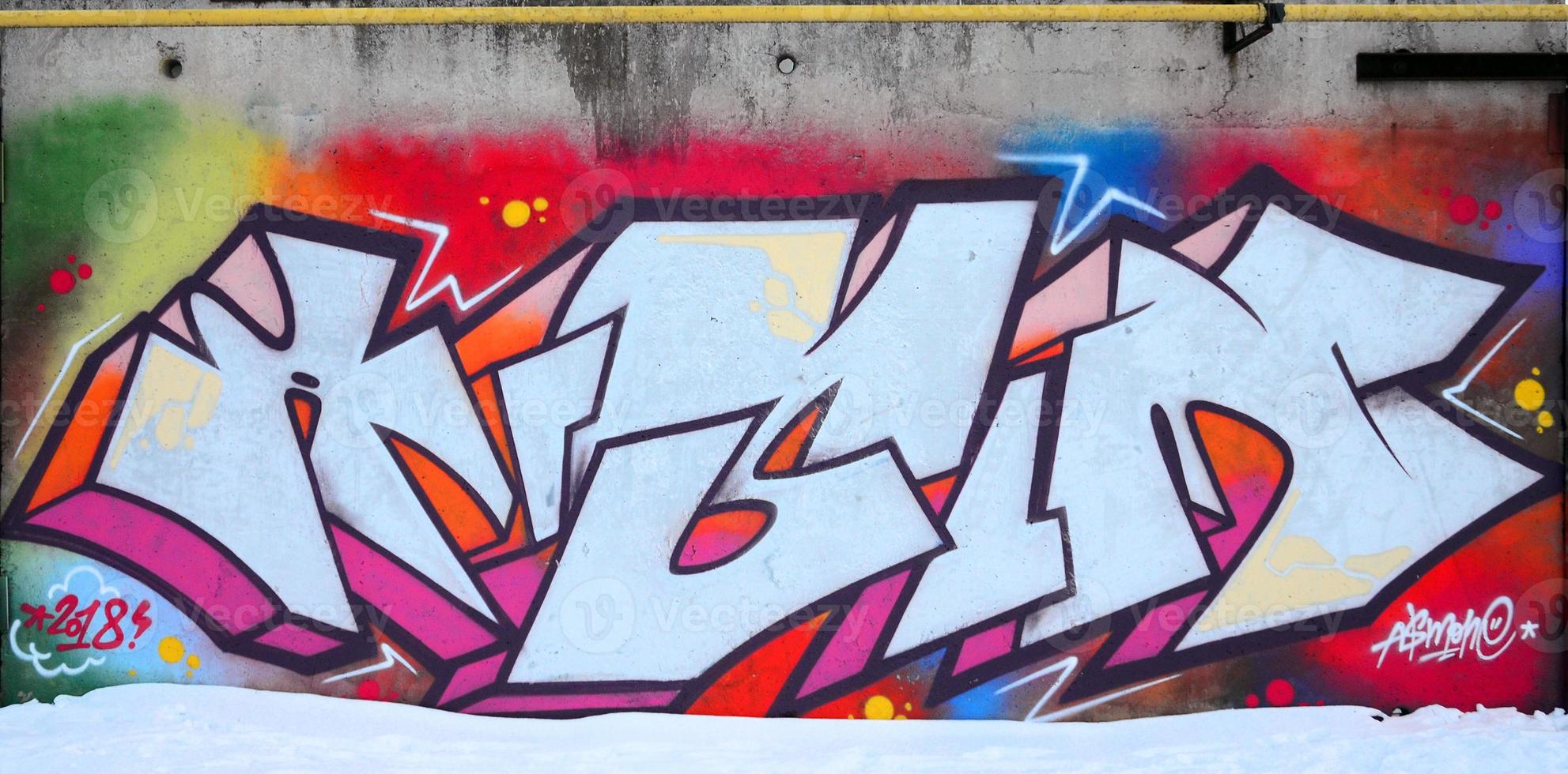 The old wall, painted in color graffiti drawing red aerosol paints. Background image on the theme of drawing graffiti and street art photo