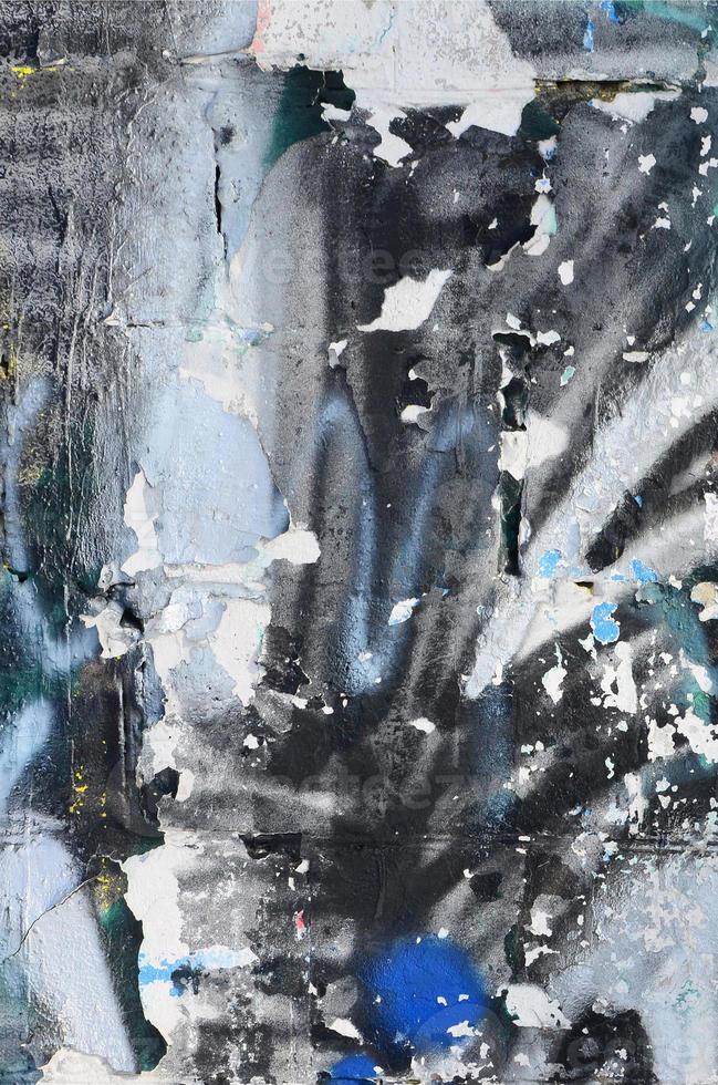 The old wall, painted in color graffiti drawing with aerosol paints. Background image on the theme of drawing graffiti and street art photo