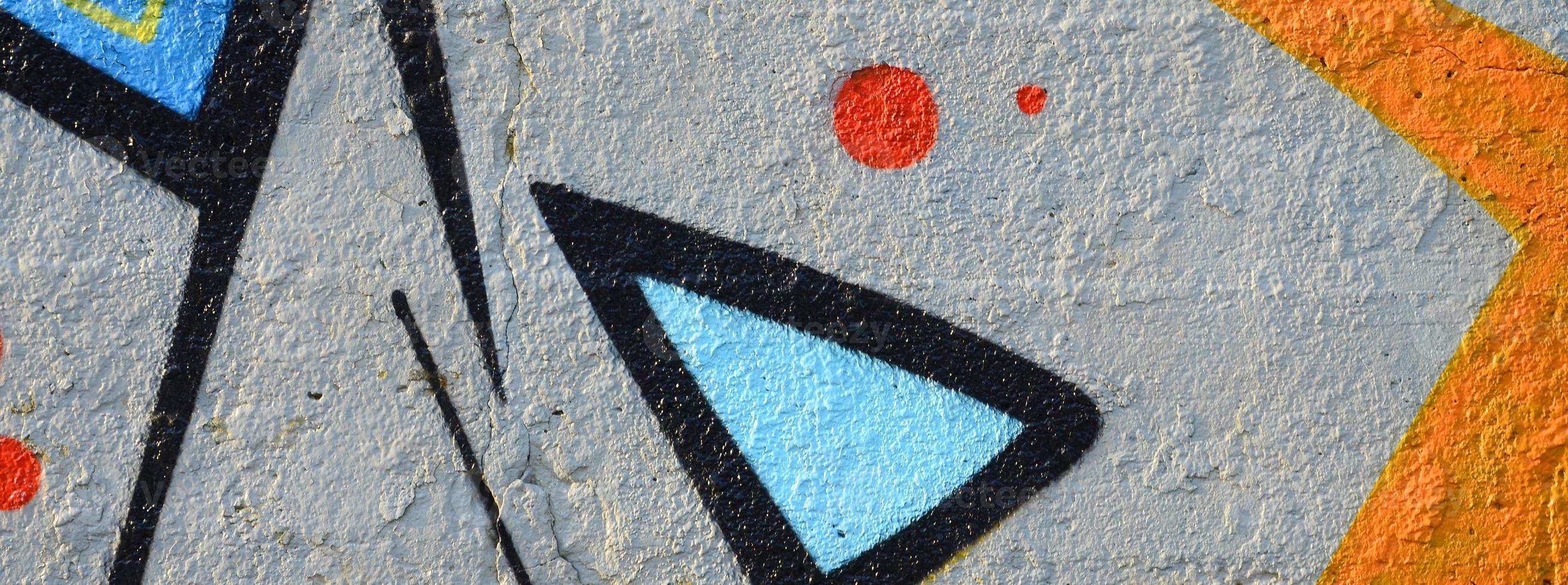The old wall, painted in color graffiti drawing blue aerosol paints. Background image on the theme of drawing graffiti and street art photo