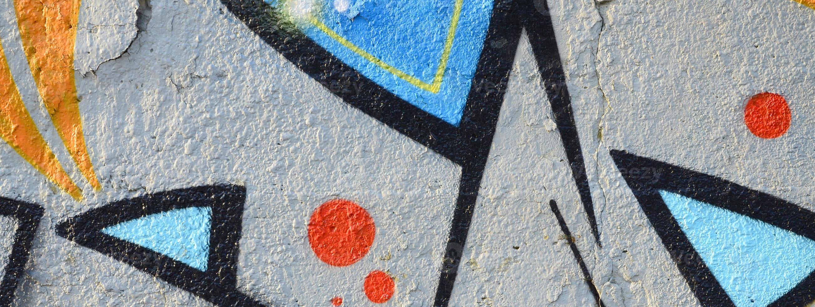 The old wall, painted in color graffiti drawing blue aerosol paints. Background image on the theme of drawing graffiti and street art photo