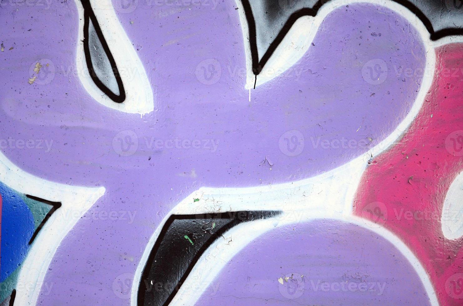 The old wall, painted in color graffiti drawing red aerosol paints. Background image on the theme of drawing graffiti and street art photo