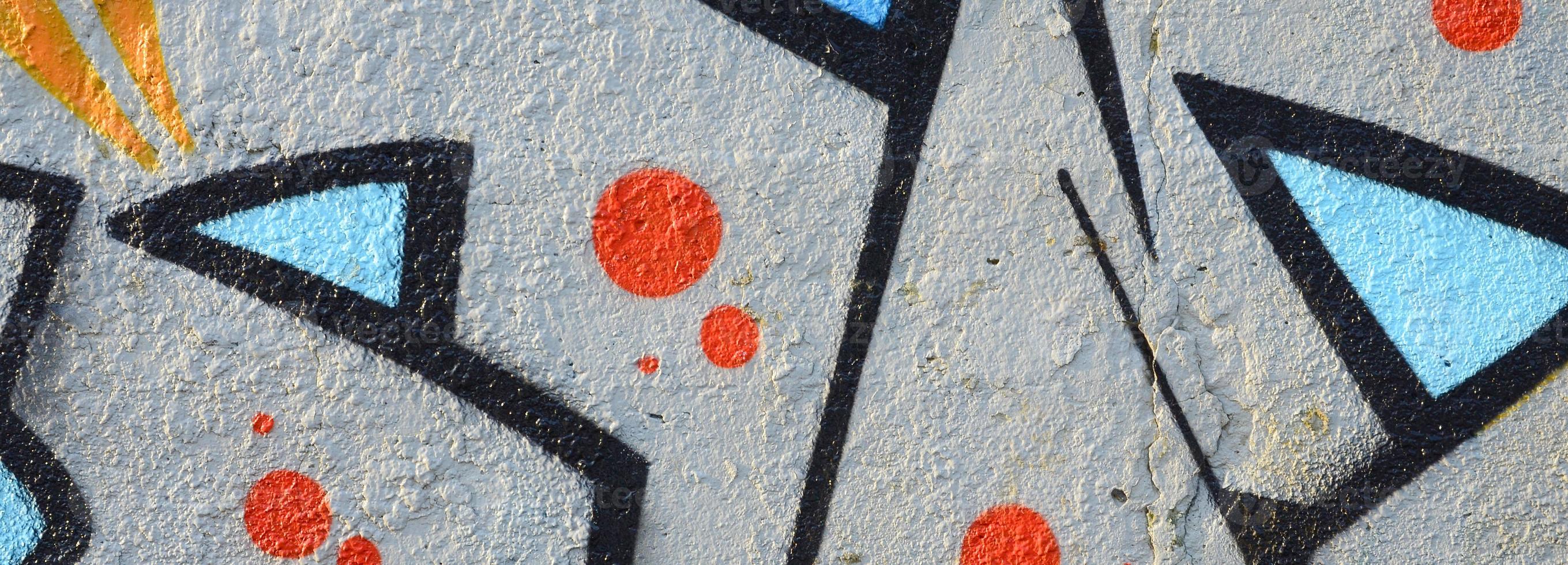 The old wall, painted in color graffiti drawing blue aerosol paints. Background image on the theme of drawing graffiti and street art photo