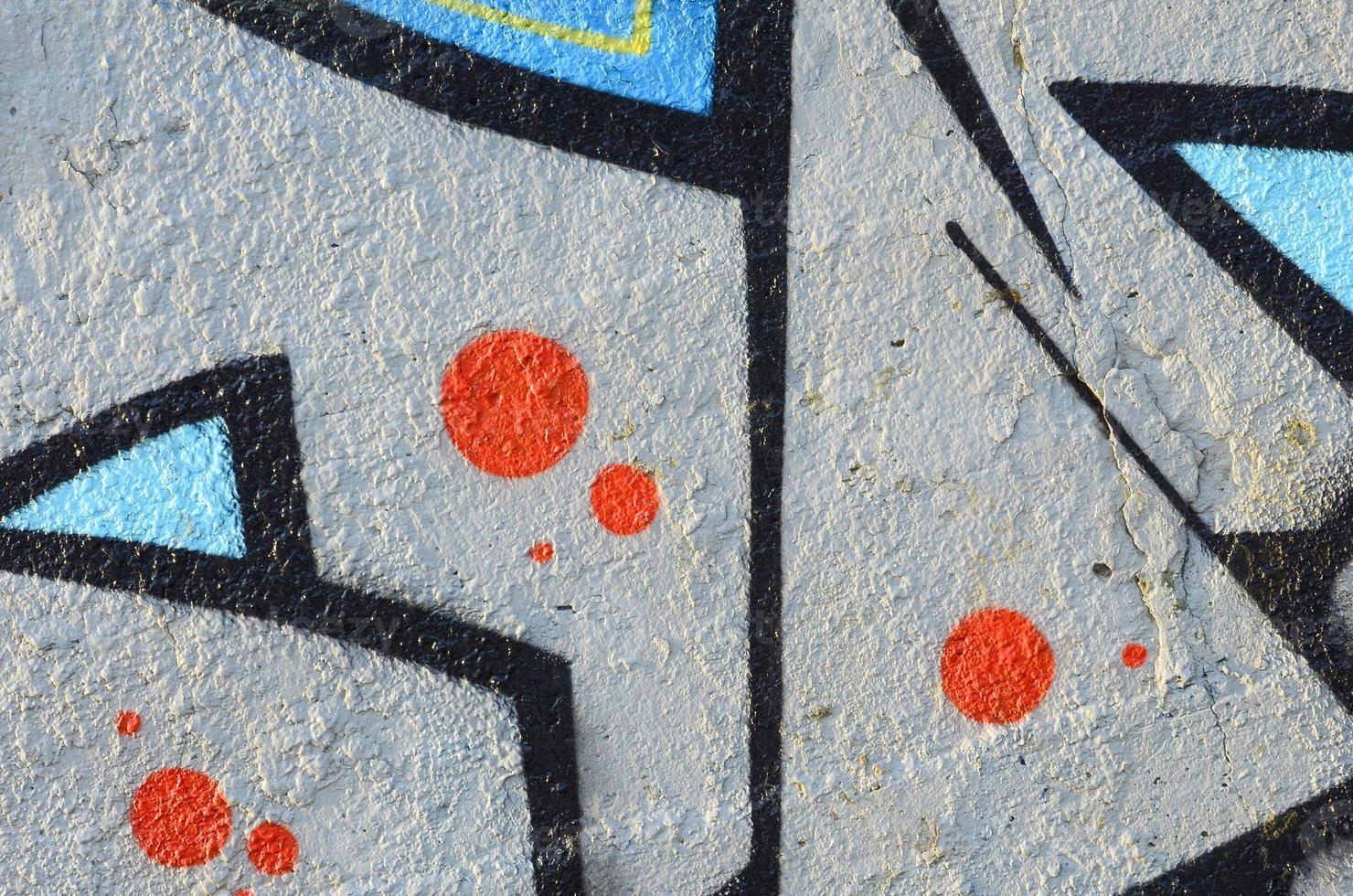 The old wall, painted in color graffiti drawing blue aerosol paints. Background image on the theme of drawing graffiti and street art photo