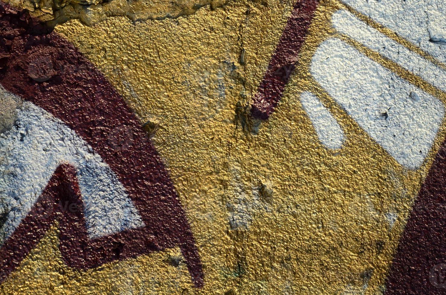 The old wall, painted in color graffiti drawing red aerosol paints. Background image on the theme of drawing graffiti and street art photo