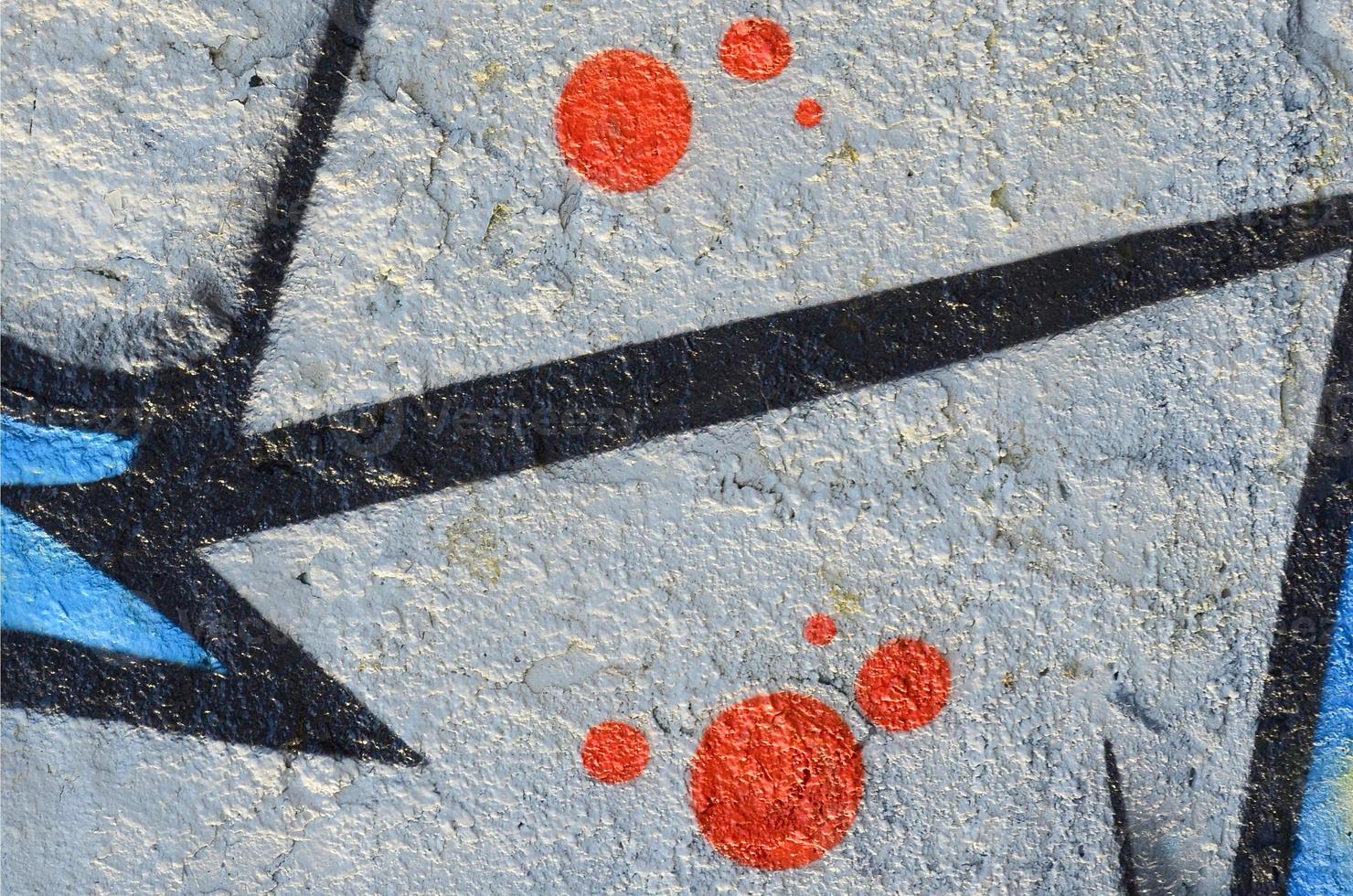 The old wall, painted in color graffiti drawing blue aerosol paints. Background image on the theme of drawing graffiti and street art photo