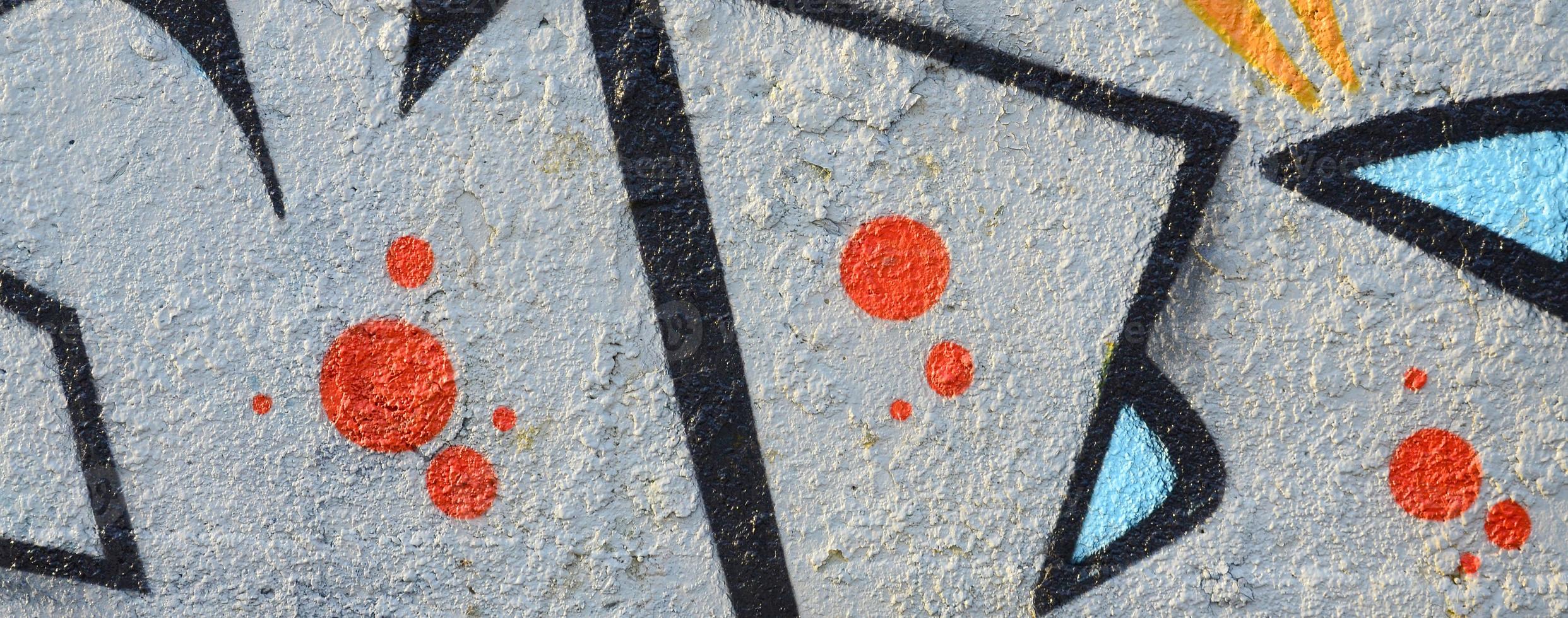 The old wall, painted in color graffiti drawing blue aerosol paints. Background image on the theme of drawing graffiti and street art photo