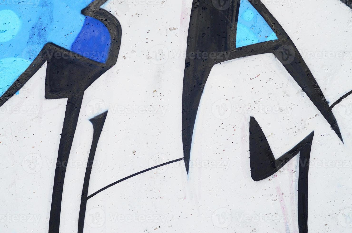 Background image of a concrete wall with a piece of abstract graffiti pattern. Street art, vandalism and youth hobbies photo