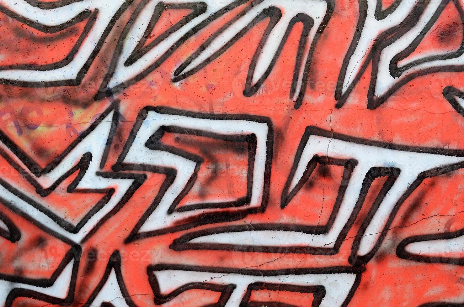 Background image of a concrete wall with a piece of abstract graffiti pattern. Street art, vandalism and youth hobbies photo
