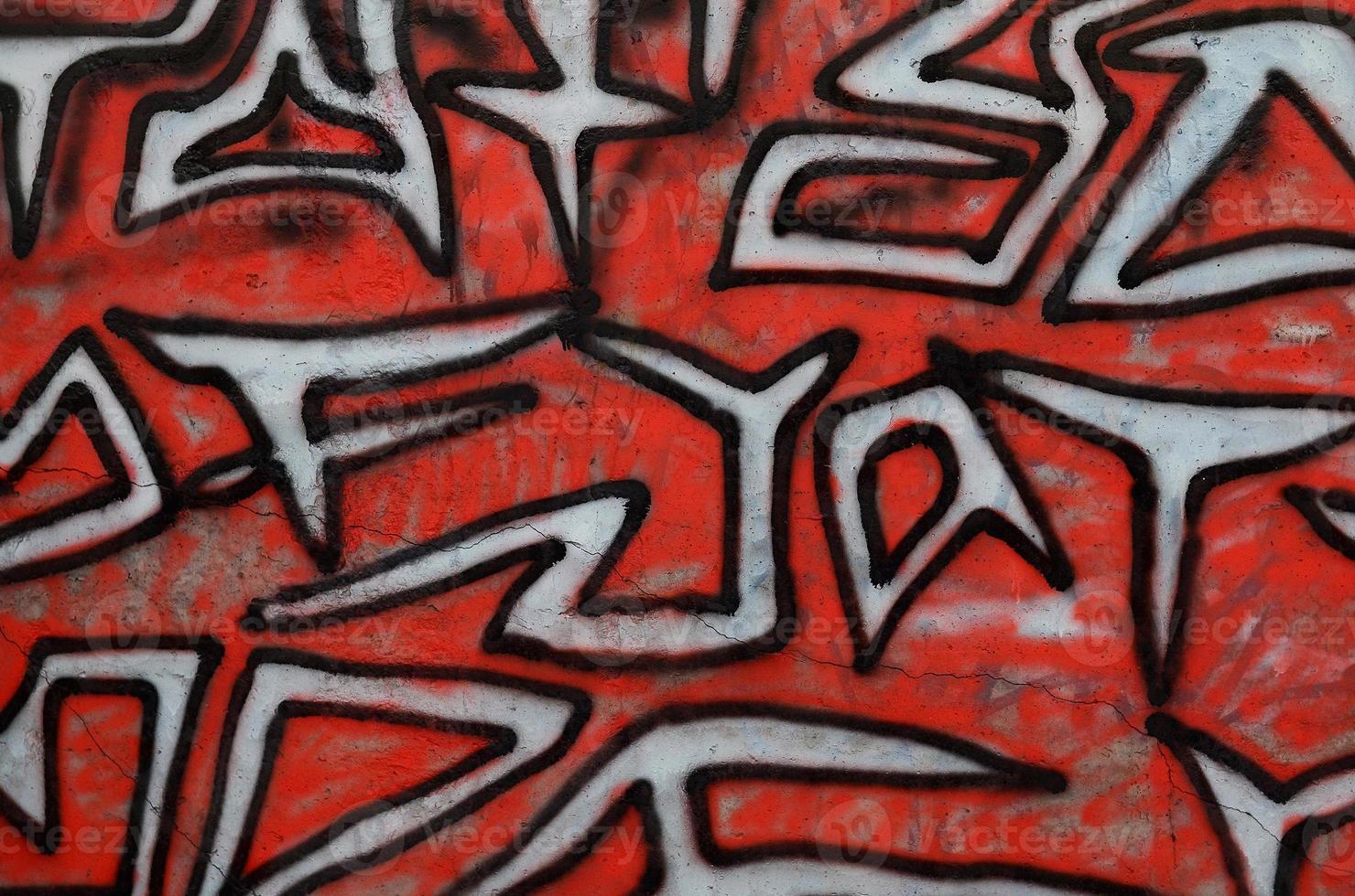 Background image of a concrete wall with a piece of abstract graffiti pattern. Street art, vandalism and youth hobbies photo