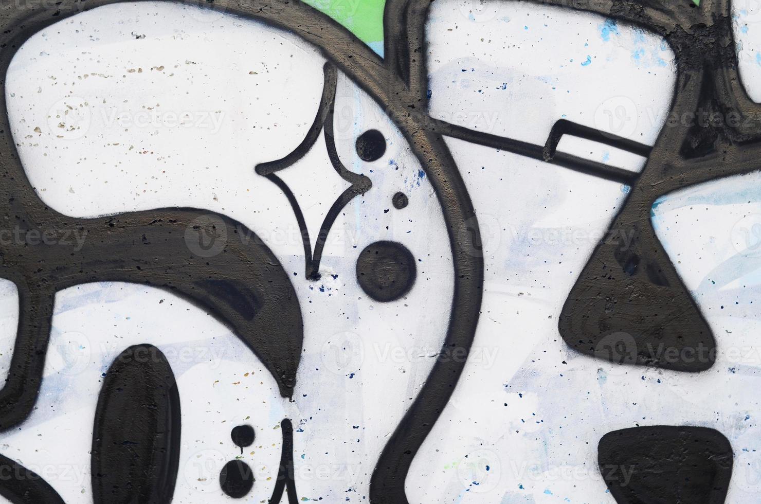 imagen de fondo de un muro de hormigón con un patrón de graffiti abstracto. arte callejero, vandalismo y aficiones juveniles foto