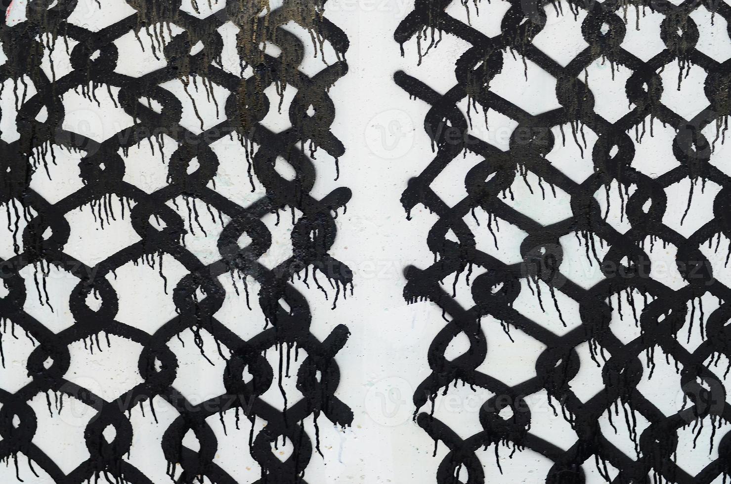 Background image of a concrete wall with a piece of abstract graffiti pattern. Street art, vandalism and youth hobbies photo
