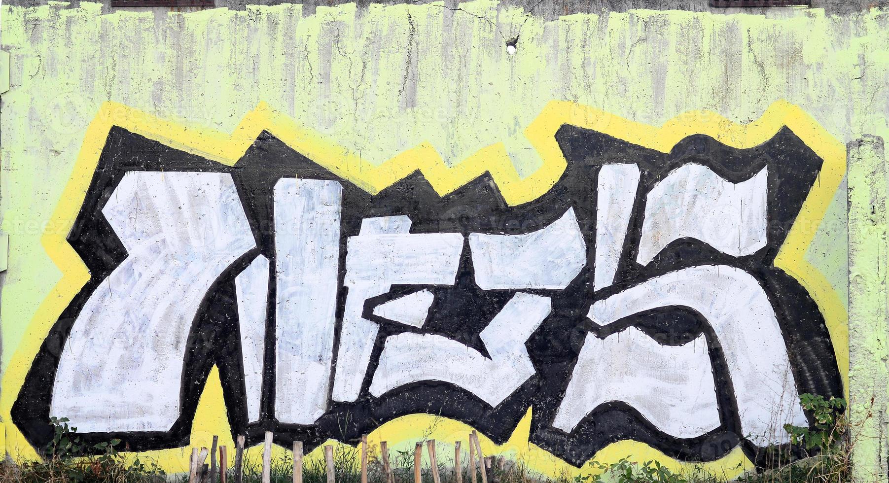 Background image of a concrete wall with a piece of abstract graffiti pattern. Street art, vandalism and youth hobbies photo