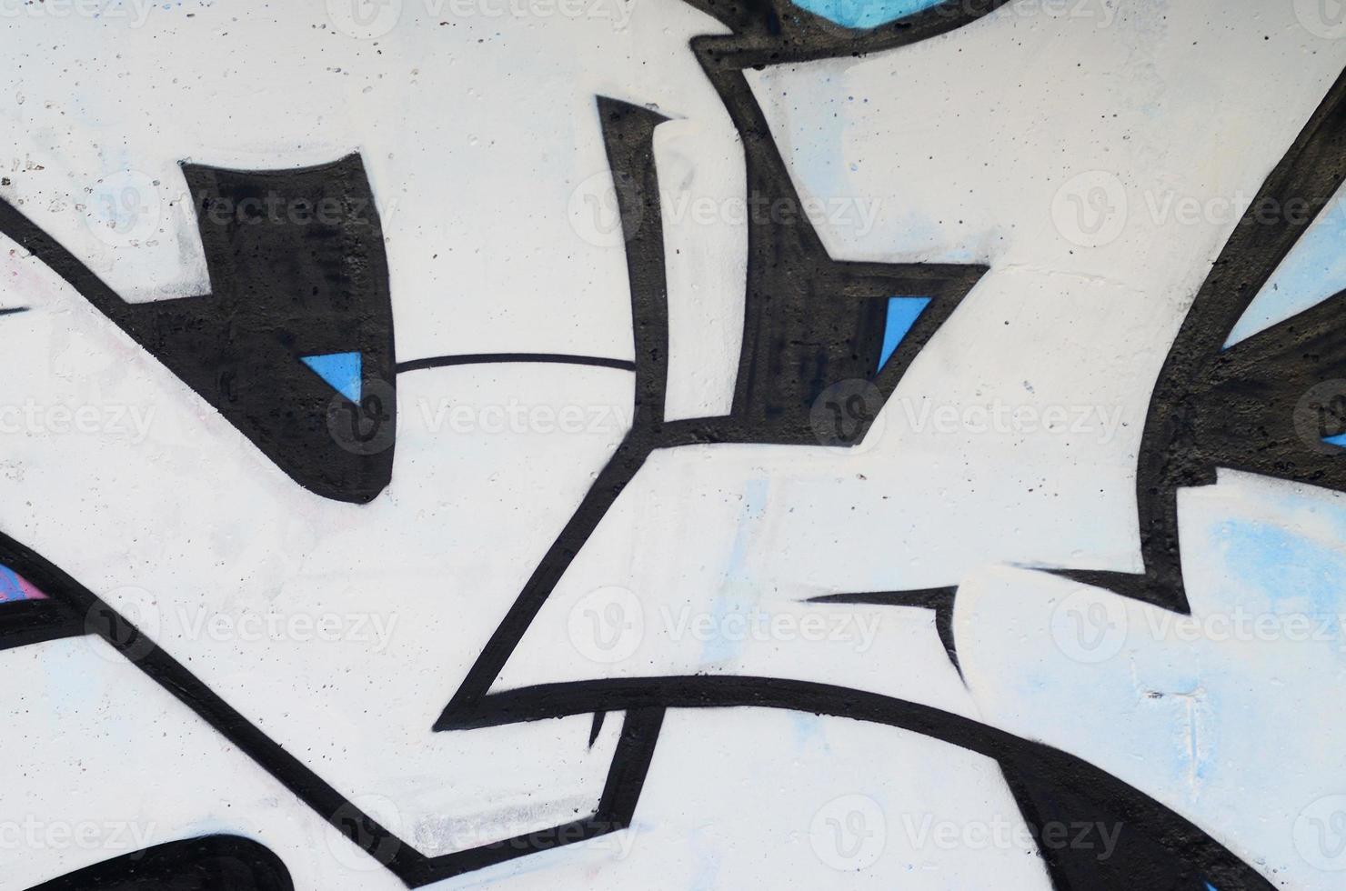 Background image of a concrete wall with a piece of abstract graffiti pattern. Street art, vandalism and youth hobbies photo