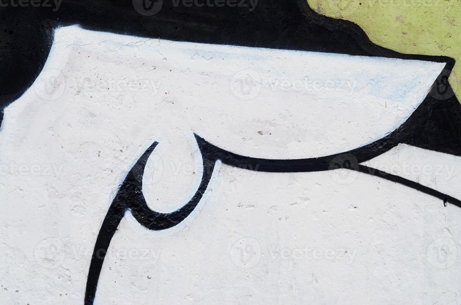 Background image of a concrete wall with a piece of abstract graffiti pattern. Street art, vandalism and youth hobbies photo