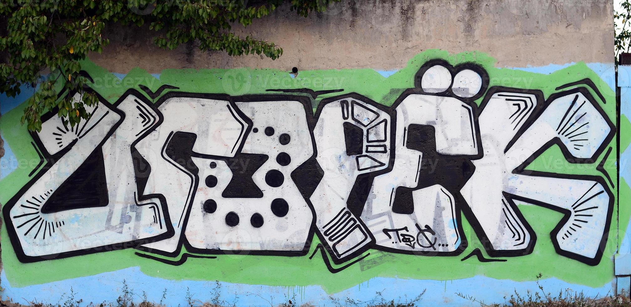 Background image of a concrete wall with a piece of abstract graffiti pattern. Street art, vandalism and youth hobbies photo