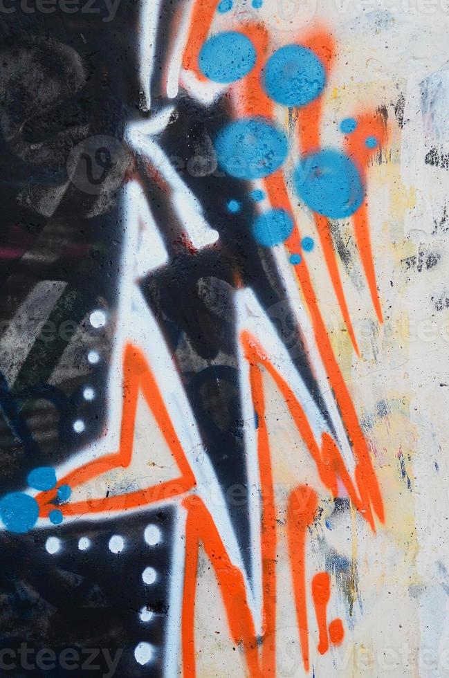 Background image of a concrete wall with a piece of abstract graffiti pattern. Street art, vandalism and youth hobbies photo