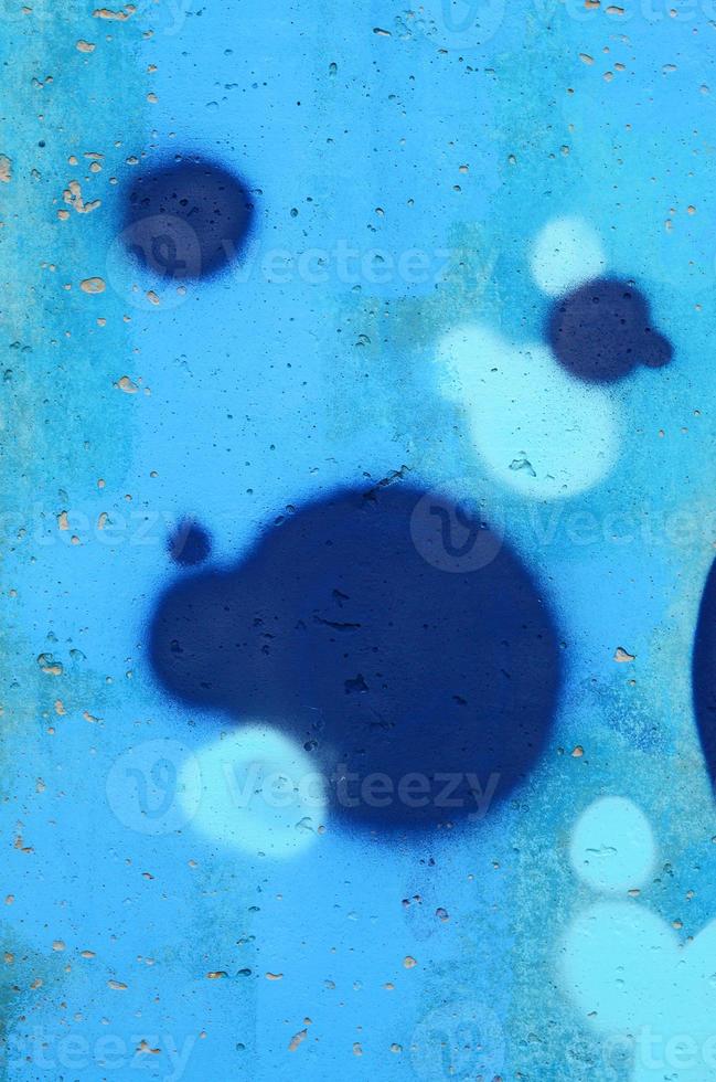 Background image of a concrete wall with a piece of abstract graffiti pattern. Street art, vandalism and youth hobbies photo