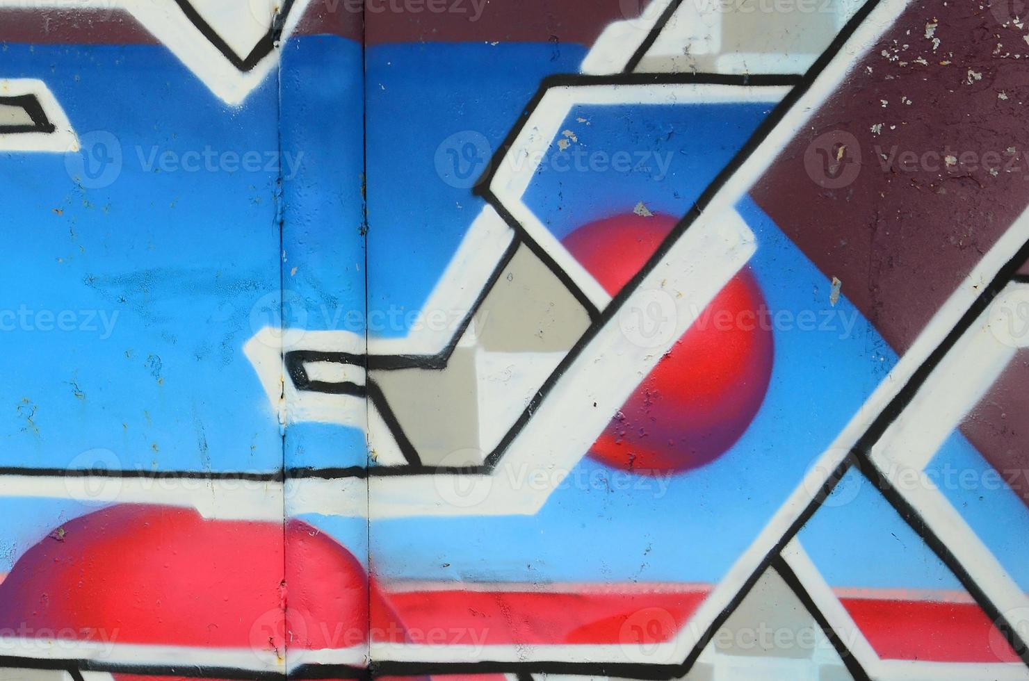 Fragment of graffiti drawings. The old wall decorated with paint stains in the style of street art culture. Colored background texture in cold tones photo