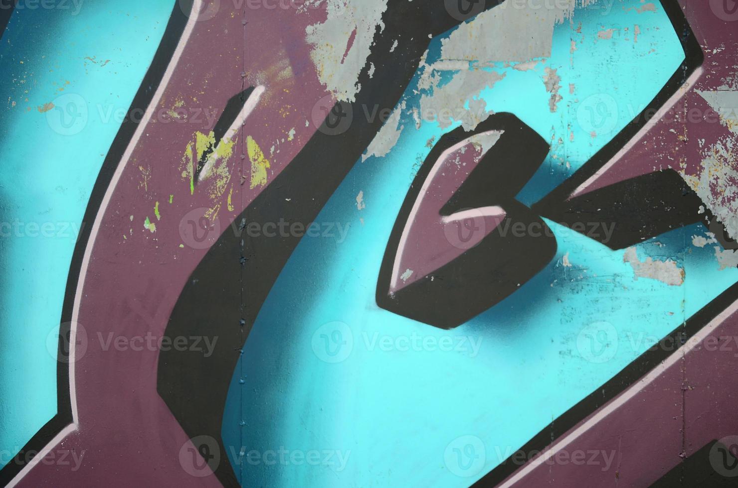 Fragment of graffiti drawings. The old wall decorated with paint stains in the style of street art culture. Colored background texture in cold tones photo