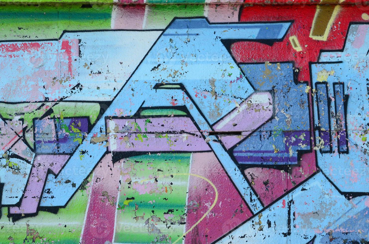 Fragment of graffiti drawings. The old wall decorated with paint stains in the style of street art culture. Colored background texture in cold tones photo