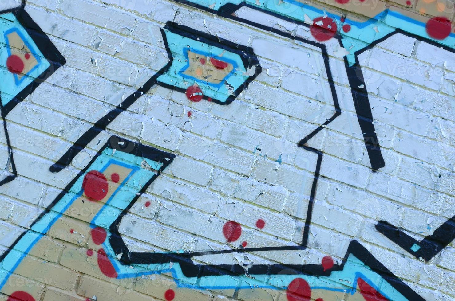 Fragment of graffiti drawings. The old wall decorated with paint stains in the style of street art culture. Colored background texture in cold tones photo
