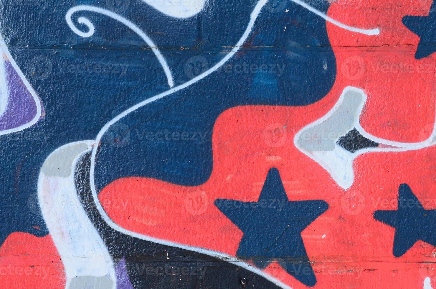 Fragment of graffiti drawings. The old wall decorated with paint stains in the style of street art culture. Colored background texture in cold tones photo