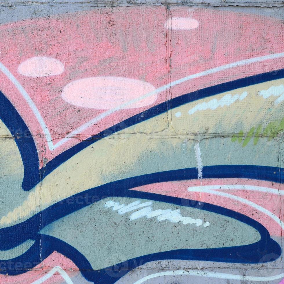 Fragment of graffiti drawings. The old wall decorated with paint stains in the style of street art culture. Colored background texture in green tones photo
