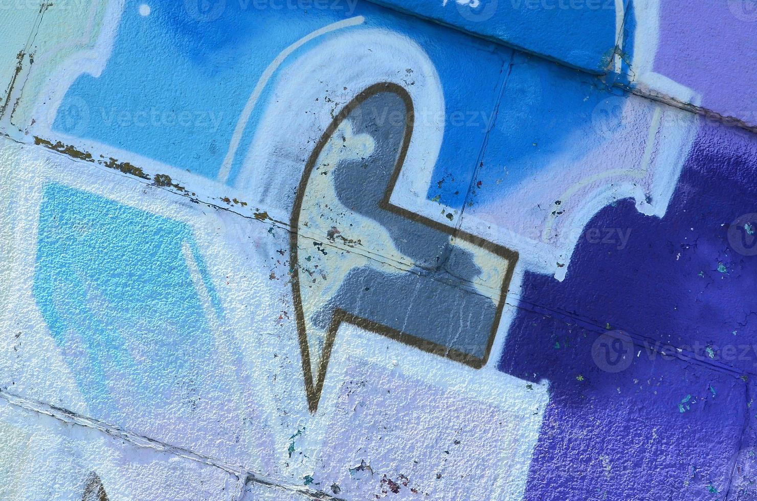 Fragment of graffiti drawings. The old wall decorated with paint stains in the style of street art culture. Colored background texture in purple tones photo