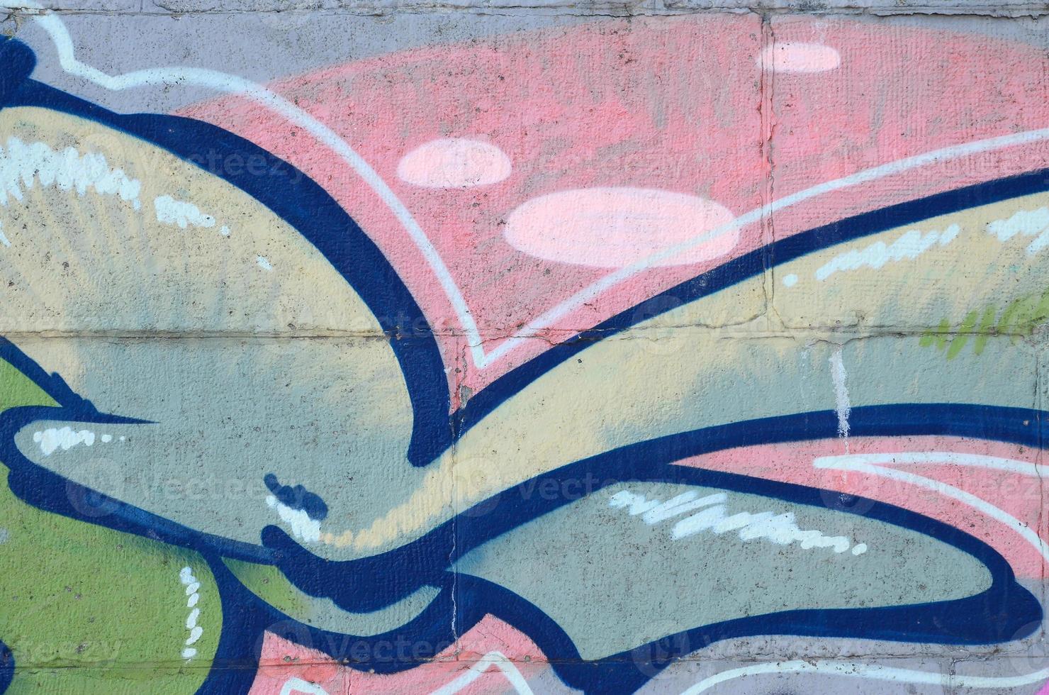 Fragment of graffiti drawings. The old wall decorated with paint stains in the style of street art culture. Colored background texture in green tones photo