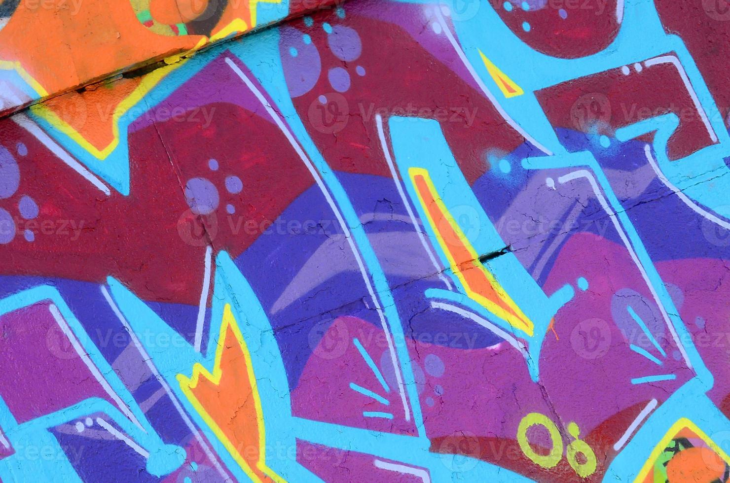 Fragment of graffiti drawings. The old wall decorated with paint stains in the style of street art culture. Colored background texture in purple tones photo