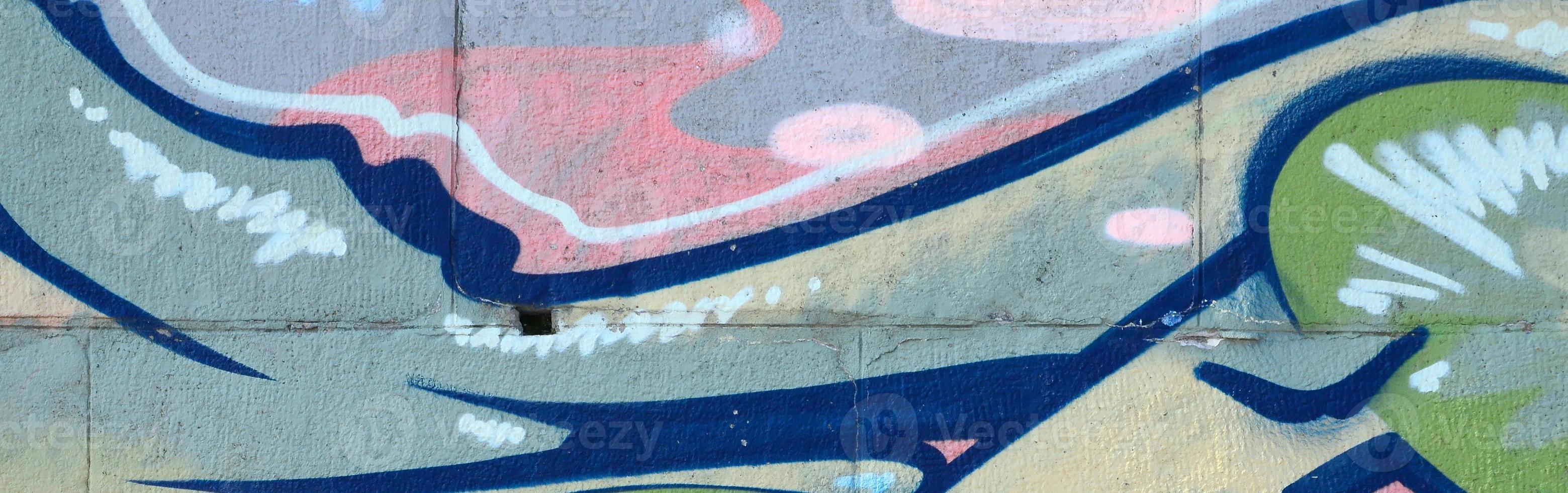 Fragment of graffiti drawings. The old wall decorated with paint stains in the style of street art culture. Colored background texture in green tones photo