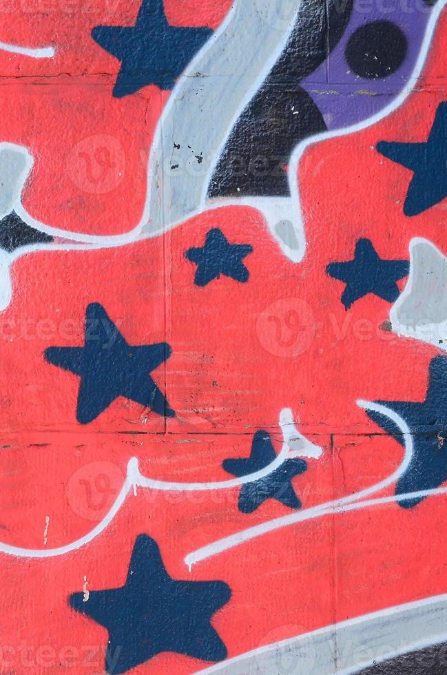 Fragment of graffiti drawings. The old wall decorated with paint stains in the style of street art culture. Colored background texture in cold tones photo