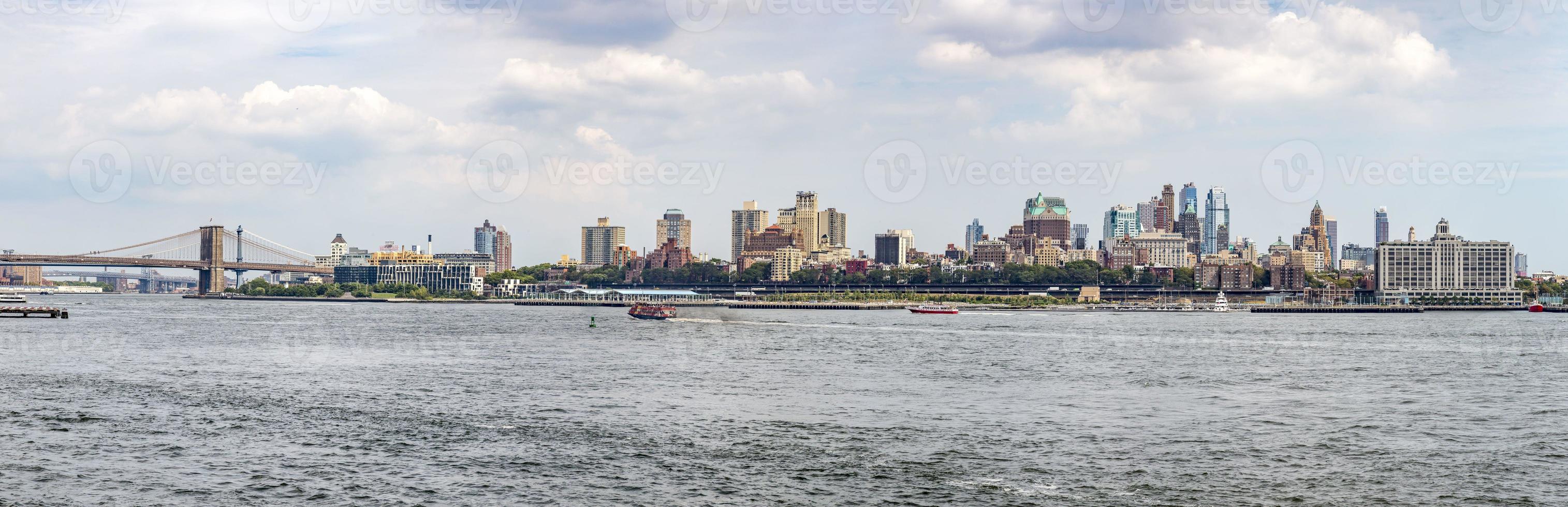 Manhattan skyline from ferry boat in summer photo