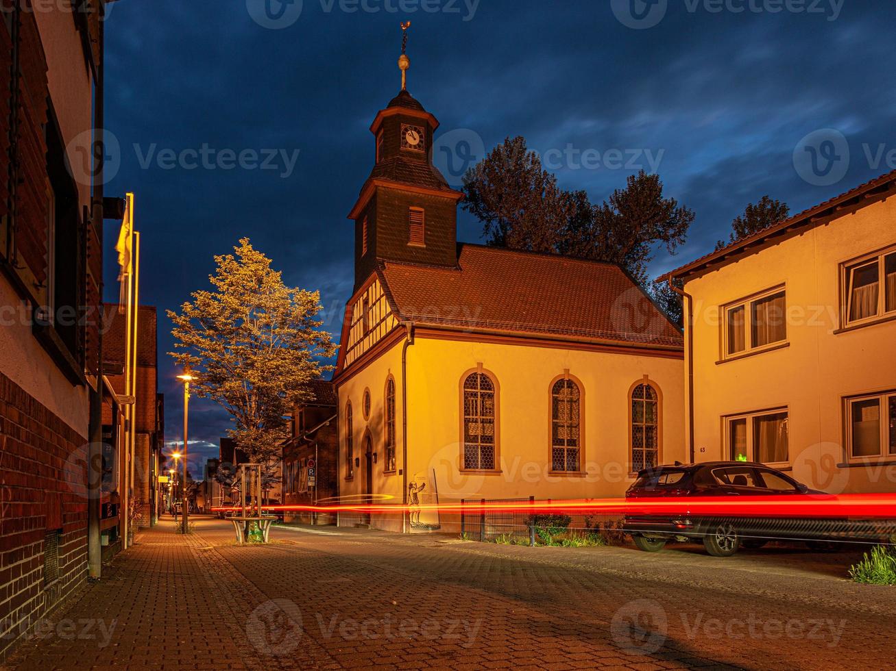 View of the historic protestant church of Walldorf in hesse during sunset photo