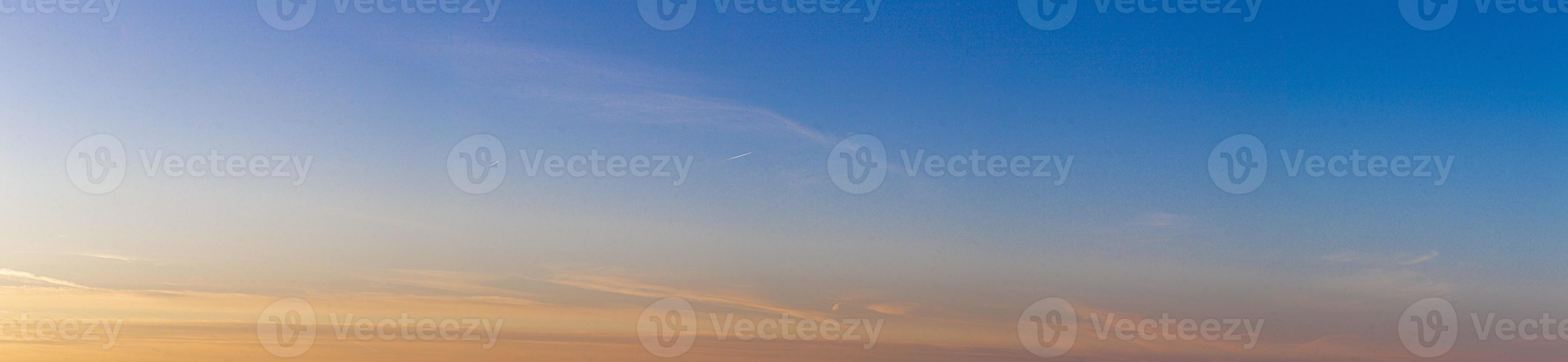 Dramatic colorful sky with afterglow and illuminated clouds photo