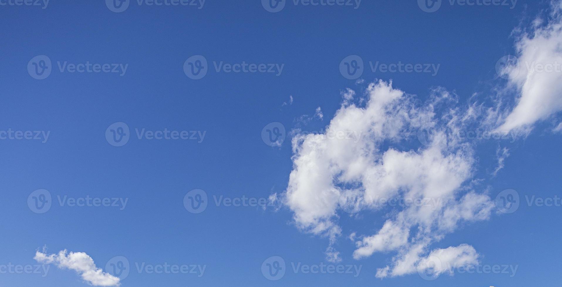 Image of a partly cloudy and partly clear sky during the day photo